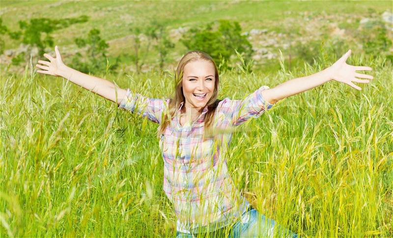 Active female over nature landscape, beautiful girl playing outdoors, young lady raised up open hands, pretty woman laughing, teenager enjoying wheat field, happy person laughing and having fun, stock photo