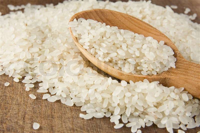 Rice grain in spoon, stock photo