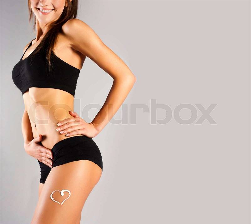Tanned skinny woman in the studio, stock photo