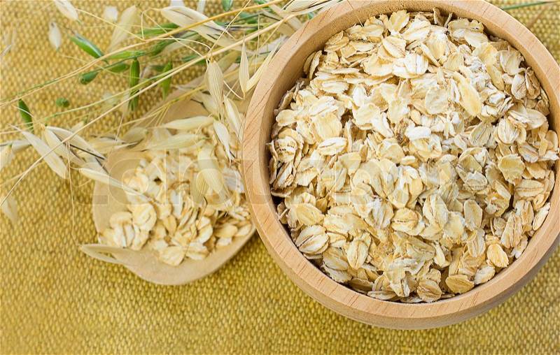 Oat Flake in Bowl on Background, stock photo
