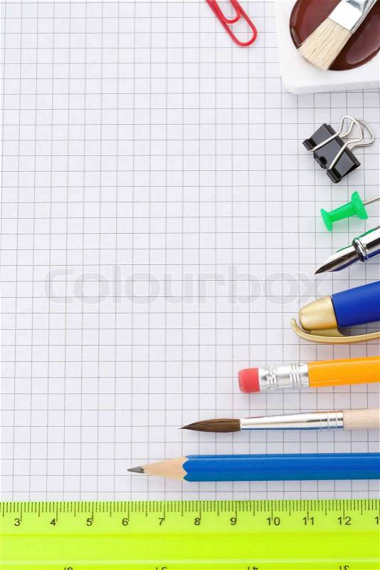 School supplies on checked background, stock photo