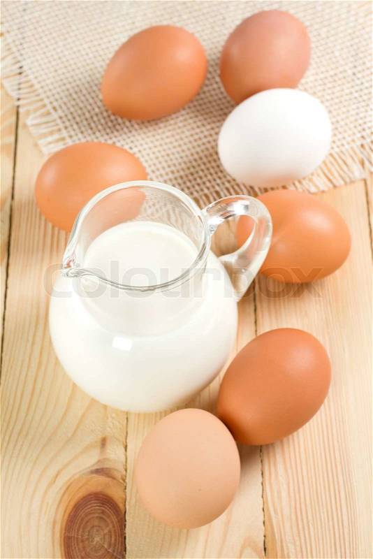 Jug with milk and eggs, stock photo