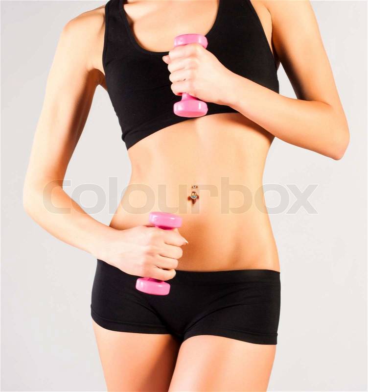 Nice sporty women body Holding dumbbell, stock photo