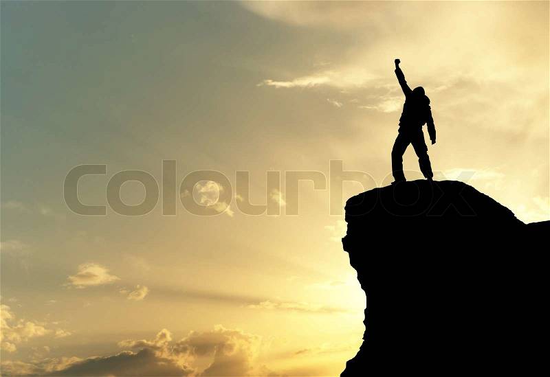 Man on top of mountain, stock photo