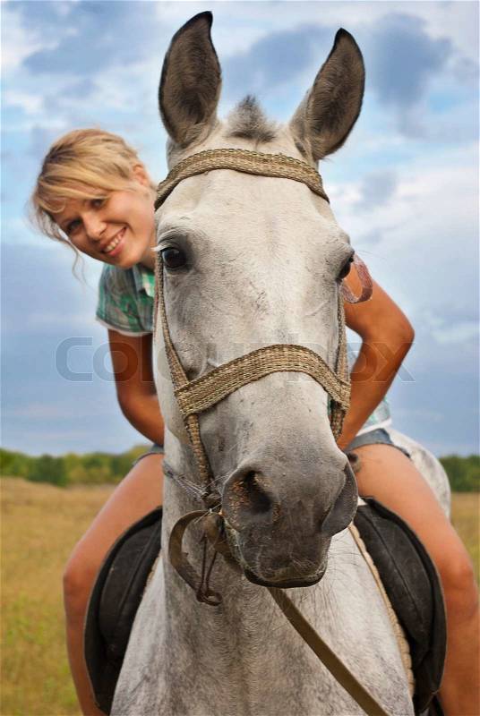 Girl and gray horse, stock photo