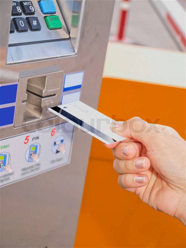 Person inserting a card into a vending machine, stock photo