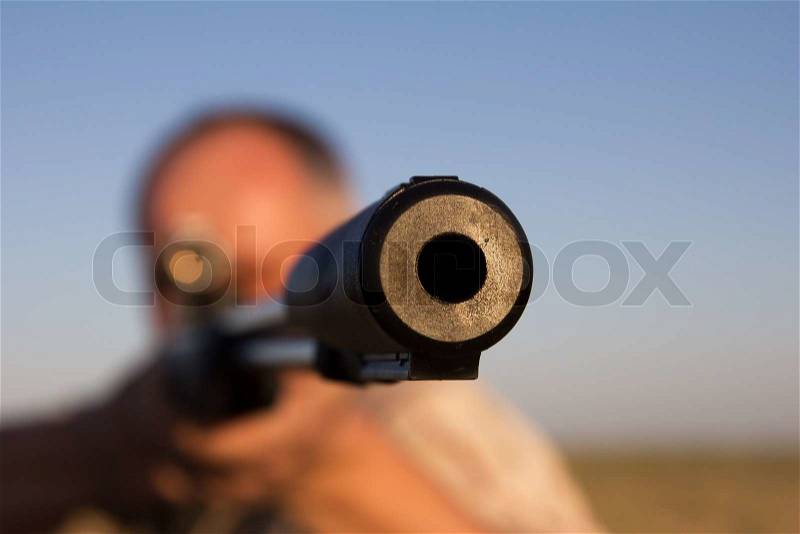 Shooting with a gun on the nature, stock photo