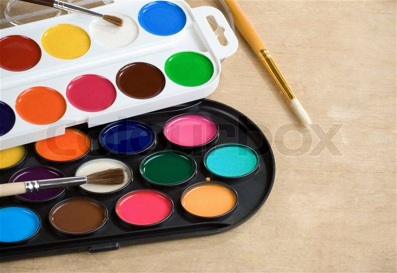 Paint brush and painters palette, stock photo