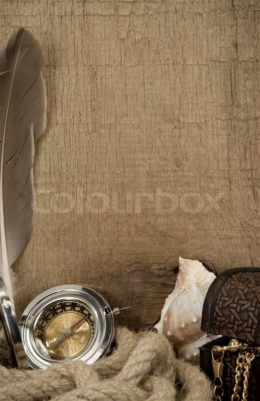 Ship ropes and compass on wood texture, stock photo