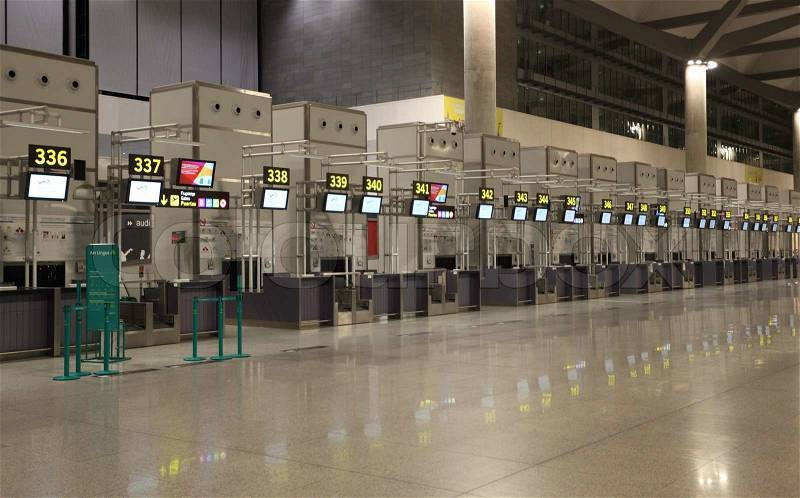 Empty airport check-in counters in Malaga, Spain Photo taken at 23rd of July 2012, stock photo