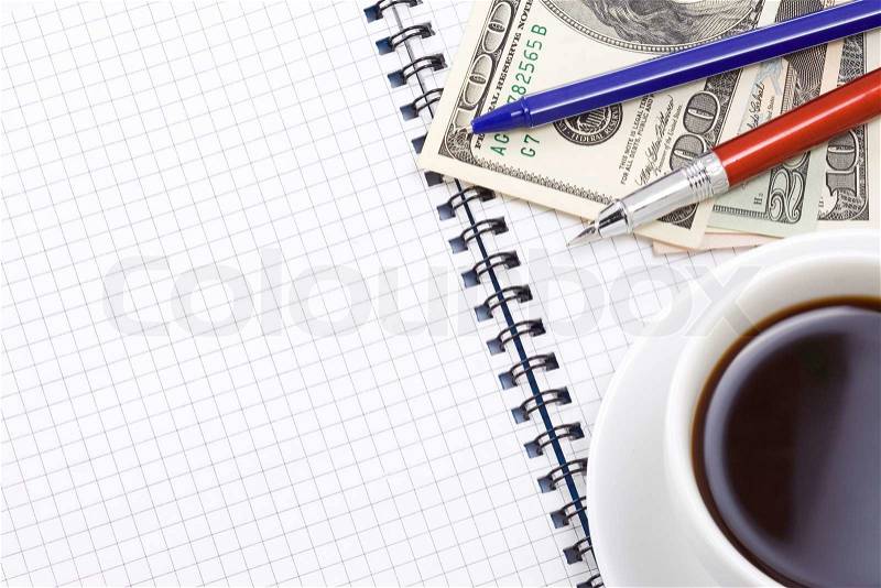 Coffee and pens on pad, stock photo