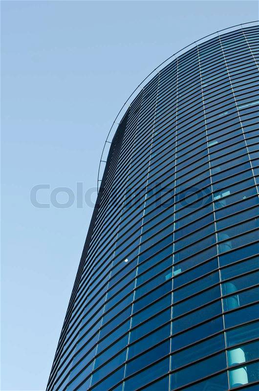 Below view of office building against sky, stock photo