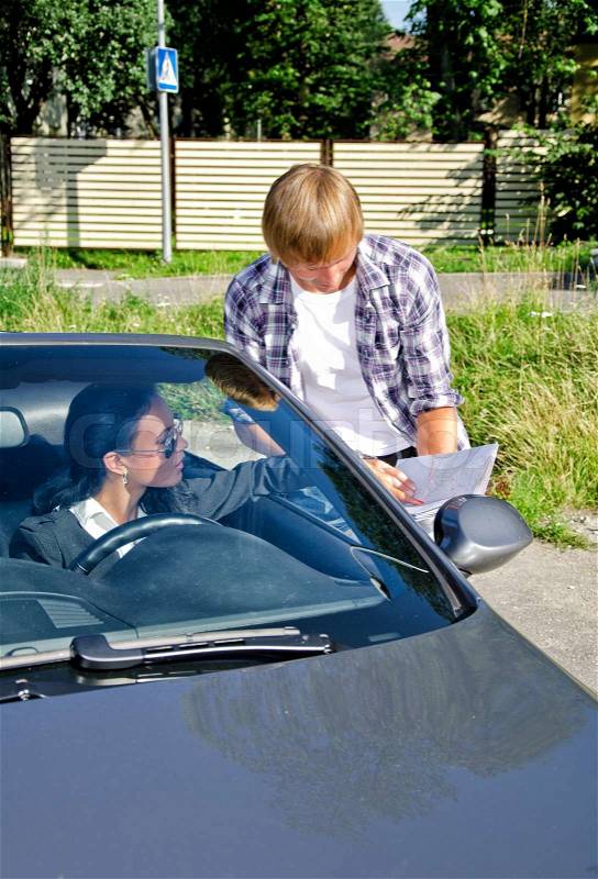 Male tourist asking female driver about direction, stock photo