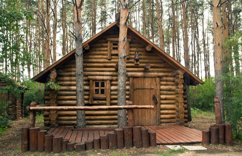 Wooden house in the woods, stock photo