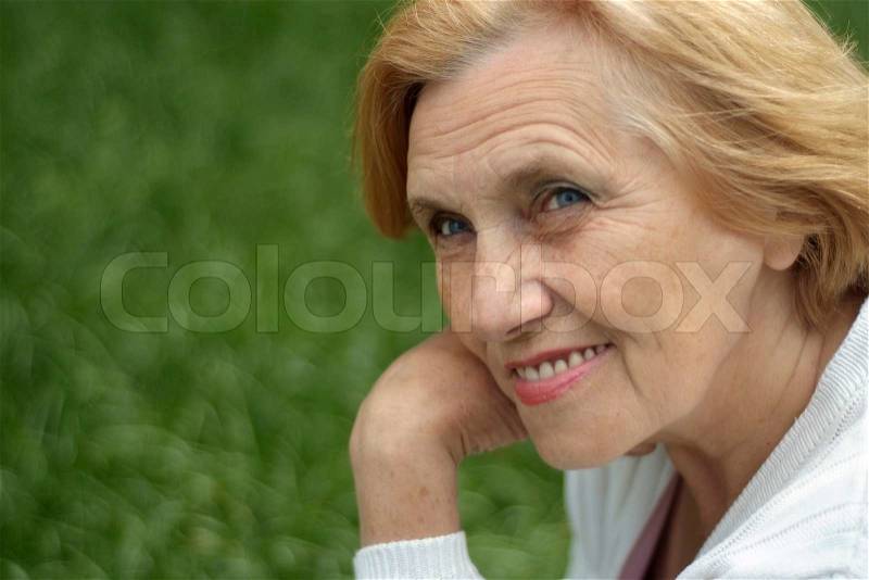 Fine elderlywoman went on the nature, stock photo