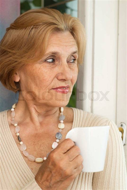 Dreaming older woman resting, stock photo
