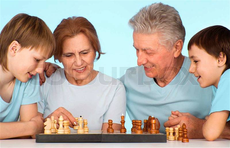 Grandpa and Grandma having fun leasure with their grandchildren, stock photo