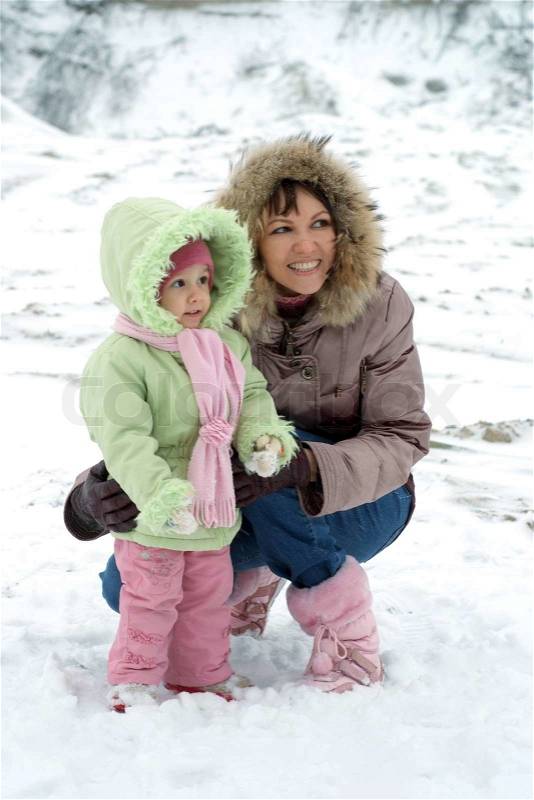 Mom and daughter in the winter, stock photo