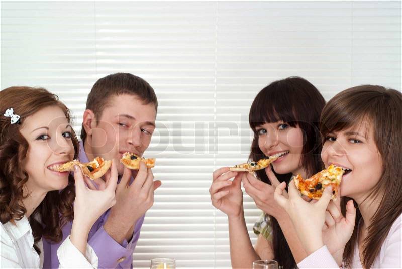 Joky people eat the pizza, stock photo