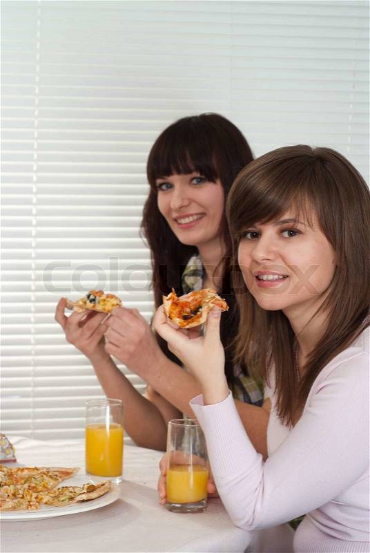 Friendly people eat the pizza, stock photo