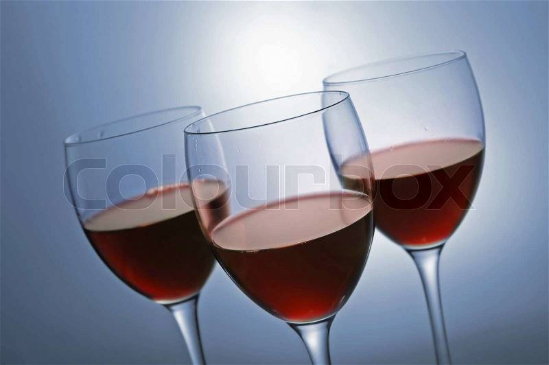 Three glasses with red wine, stock photo