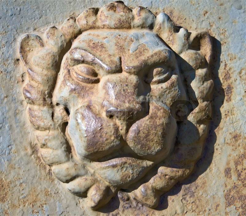 Metal Lion head on the wall, stock photo