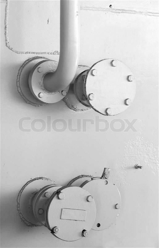 Abstract industrial background with white naval wall and fragment of tubing, stock photo