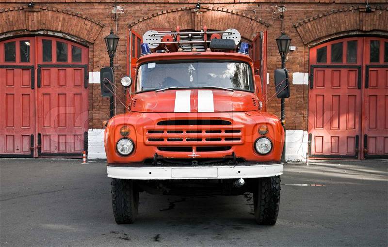 Classical russian fire engine are ready to departure from the gate of fire station, stock photo
