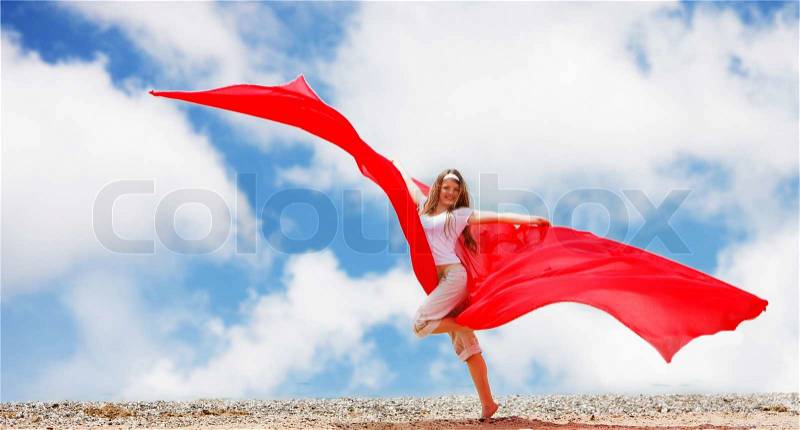 Young woman on sky background with red tissue, stock photo