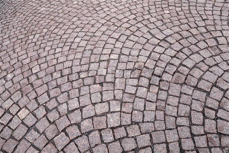 Background texture of granite cobblestone road, stock photo