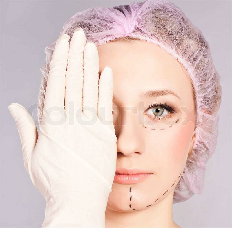 Lines onlady face, as marks for cosmetic plastic surgery, stock photo