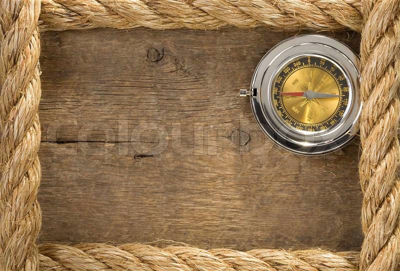 Ship ropes and compass with pen on old vintage, stock photo