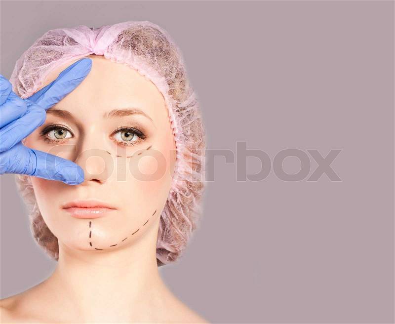 Young girl in front of plastic surgery on her face, stock photo