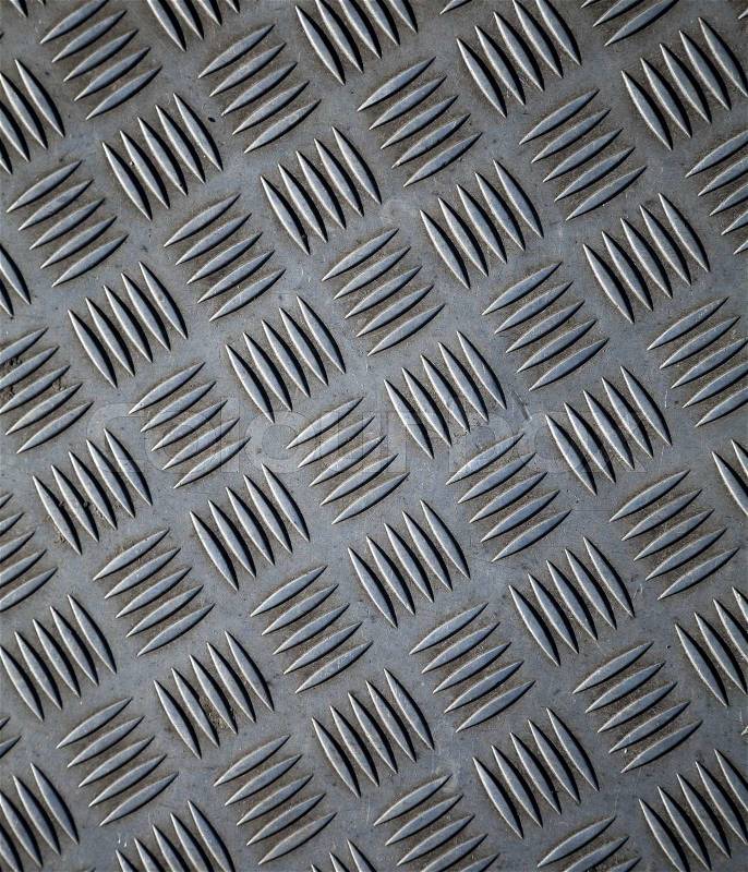 Closeup texture of diamond metal plate with details, stock photo