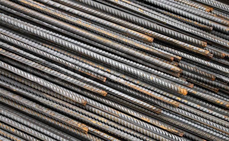 Background texture of steel rods used in construction to reinforce concrete, stock photo