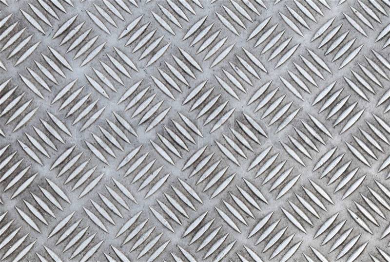 Closeup texture of diamond metal plate with details, stock photo
