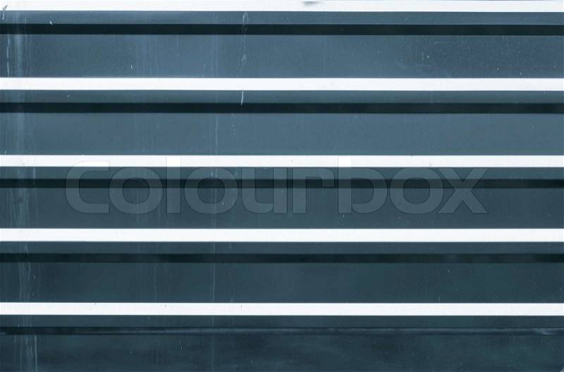 Horizontal ridged blue metal wall background texture, stock photo