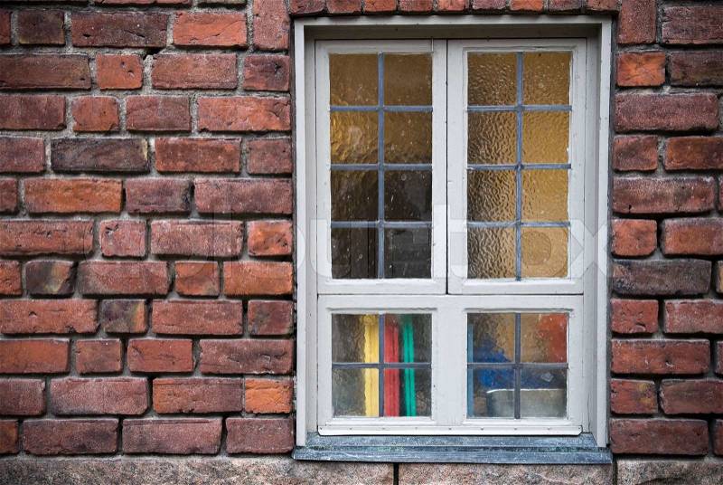 Background texture of old red brick wall with window, stock photo