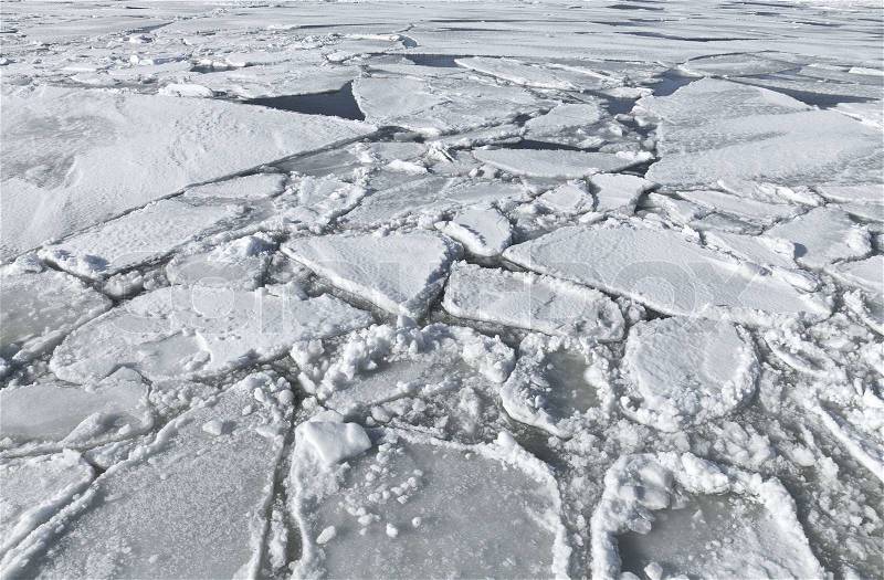 Blocks of ice on frozen lake Background texture, stock photo