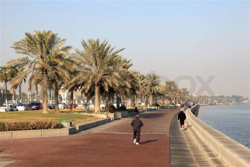 People walking on the corniche of Doha, Qatar Photo taken at 6th of January 2012, stock photo