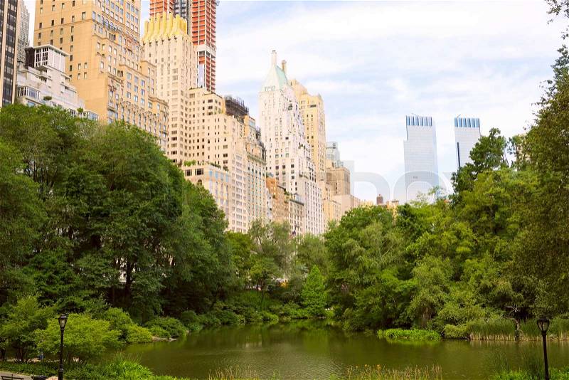 Central Park, The Pond and Manhattan skyline, New York, stock photo