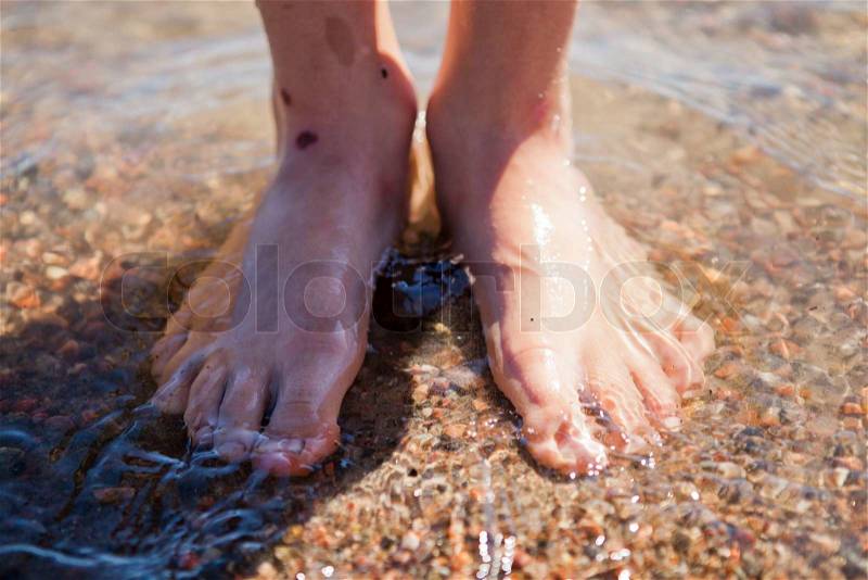 Feet in water, stock photo