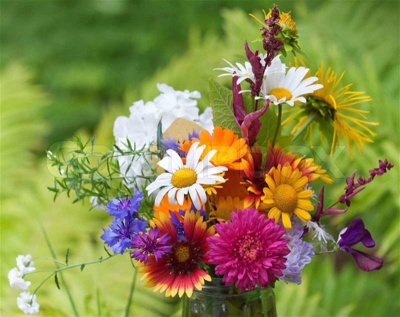 Bright colorful bouquet of garden and wild natural flowers, selective focus, stock photo