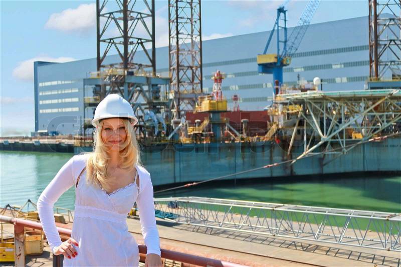 Woman engineer shipbuilder at the shipyard, stock photo