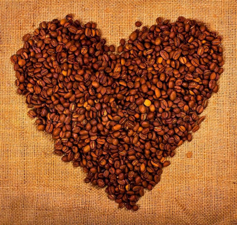 Heart shape created with coffee beans, stock photo