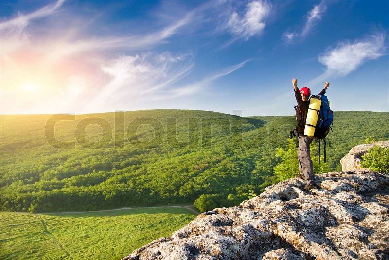Man on top of mountain, stock photo