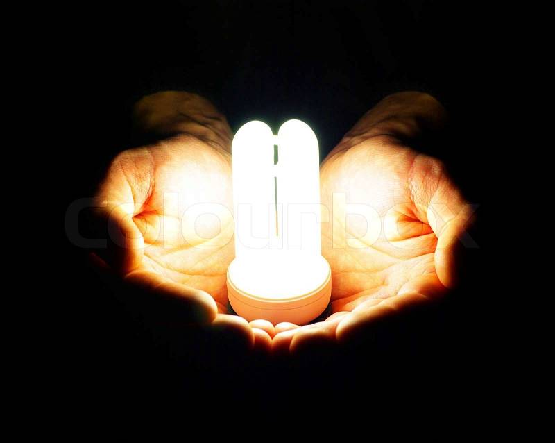 Lamp in hand, stock photo