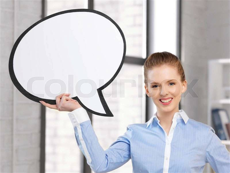 Smiling businesswoman with blank text bubble, stock photo