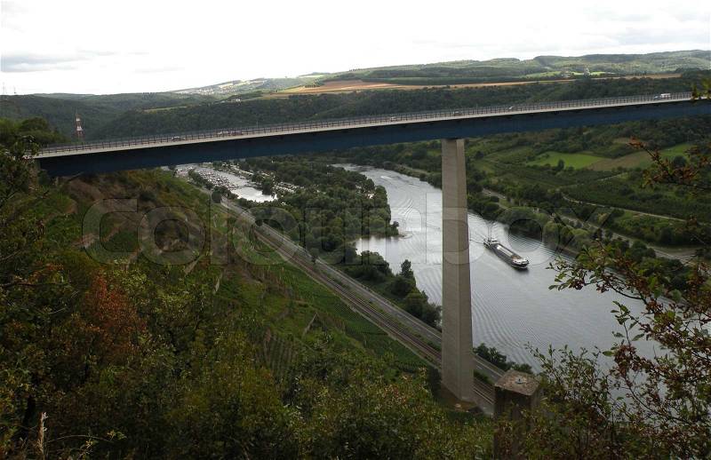 Motorway bridge high above Mosel valley and river with vinyards, stock photo