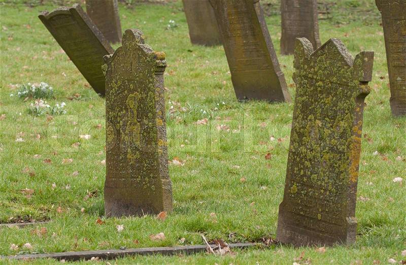 Tombstones on an old graveyard, stock photo